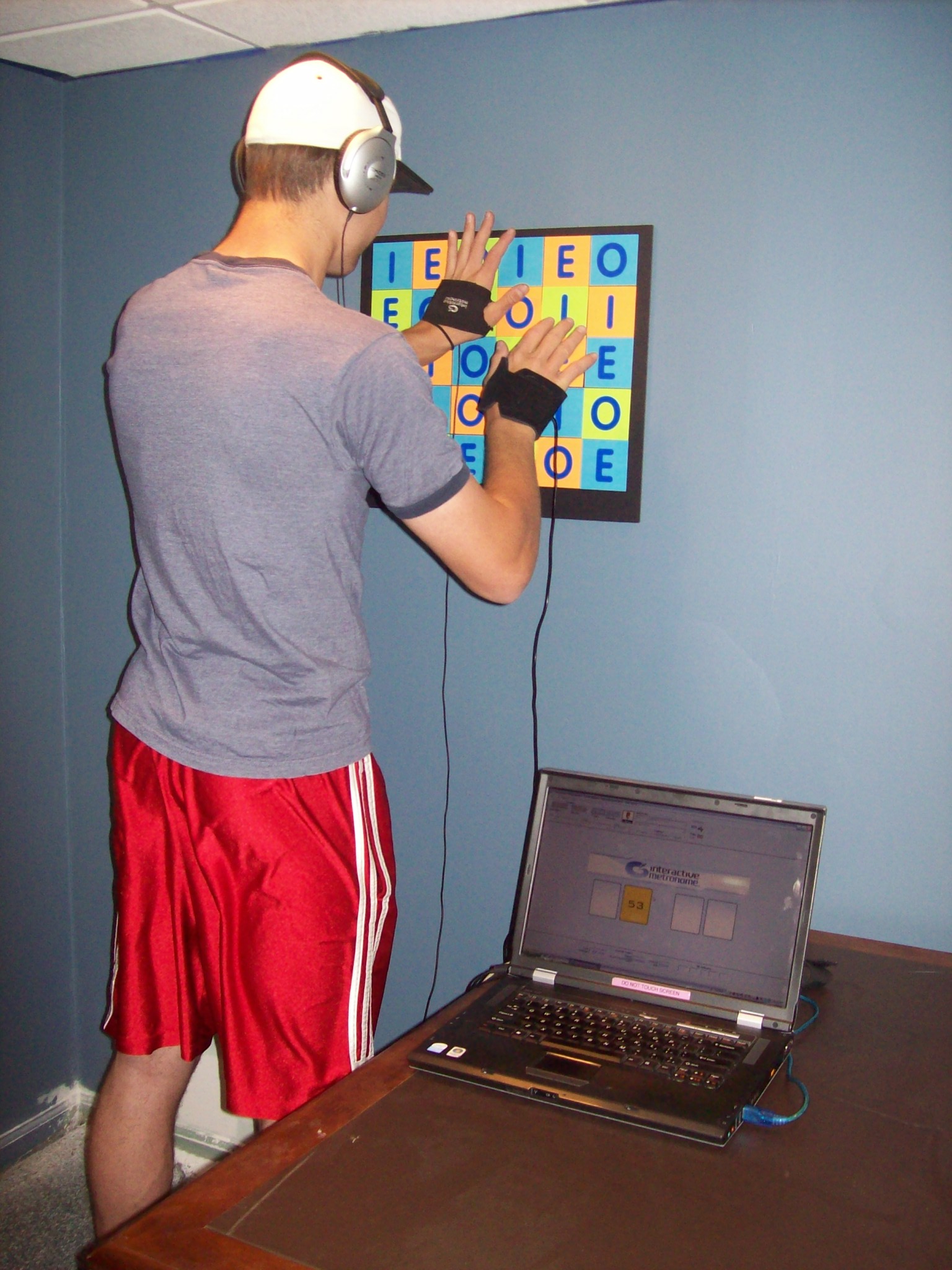 Biofeedback young man using the interactive metronome