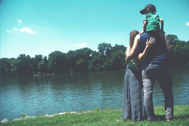 A happy family on the side of a lake near Sadar Psychological and Sports Center