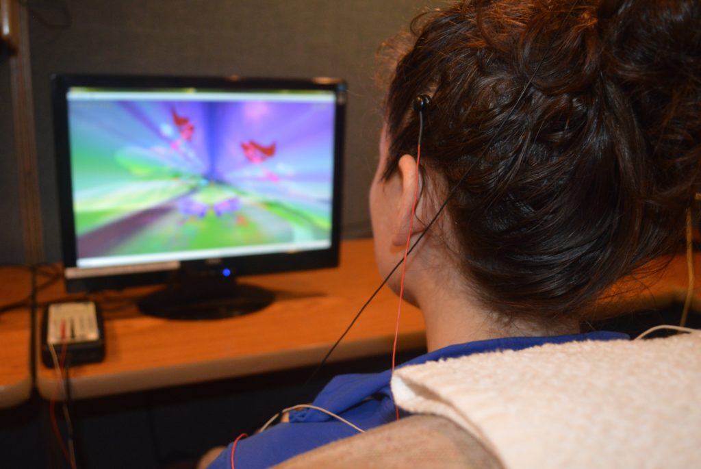 View over a client's shoulder while she does neurofeedback